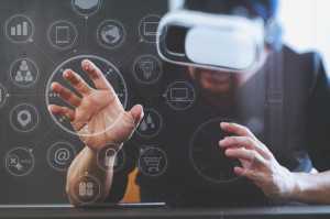 businessman wearing virtual reality goggles in modern office wit