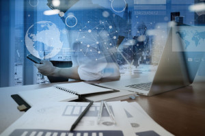 businessman hand working with modern technology and digital laye