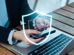 Secure payment concept. The large shield icon glowing while busi